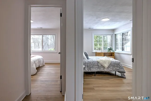 a bedroom with furniture and a window