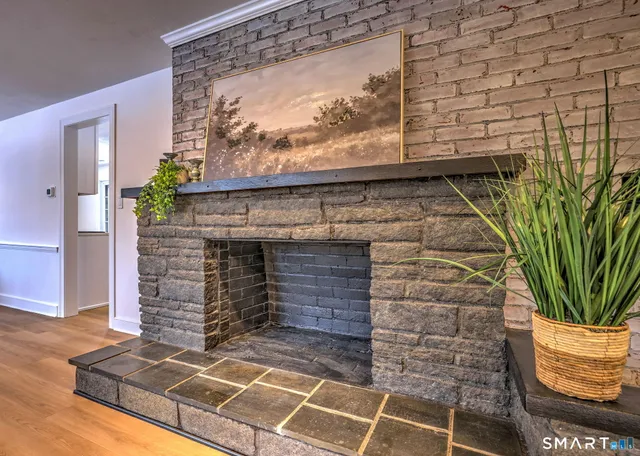 a view of fireplace and wooden floor