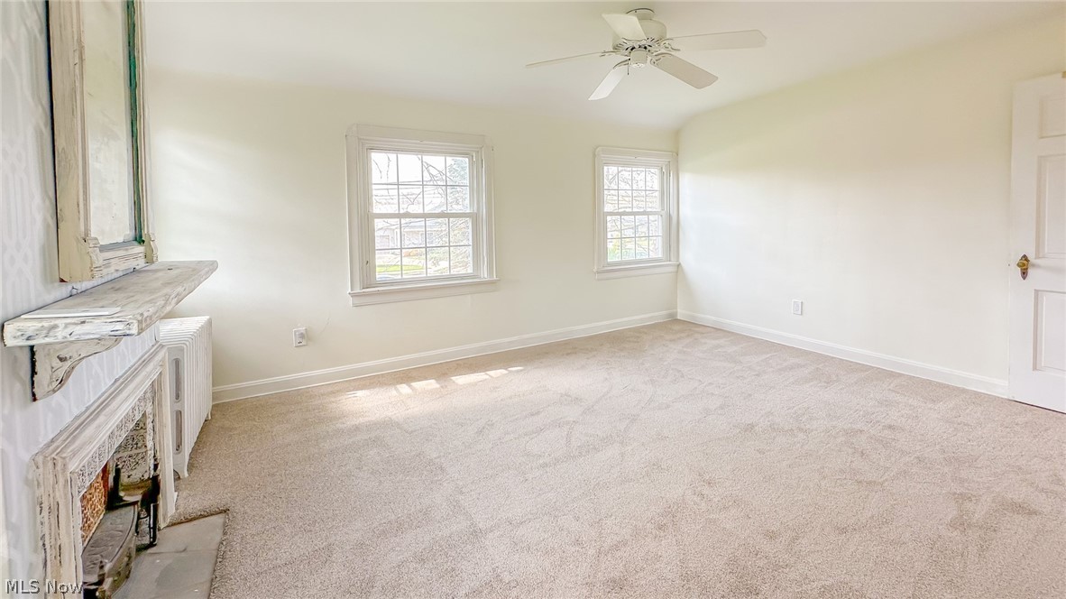 25819 Center Ridge Road Westlake, OH 44145 - Photo 19 of 45 Master bedroom with natural light new carpet and ceiling fan