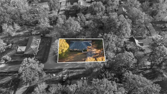 a aerial view of a house with a yard