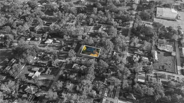 a view of a kitchen with wooden floor and a chandelier