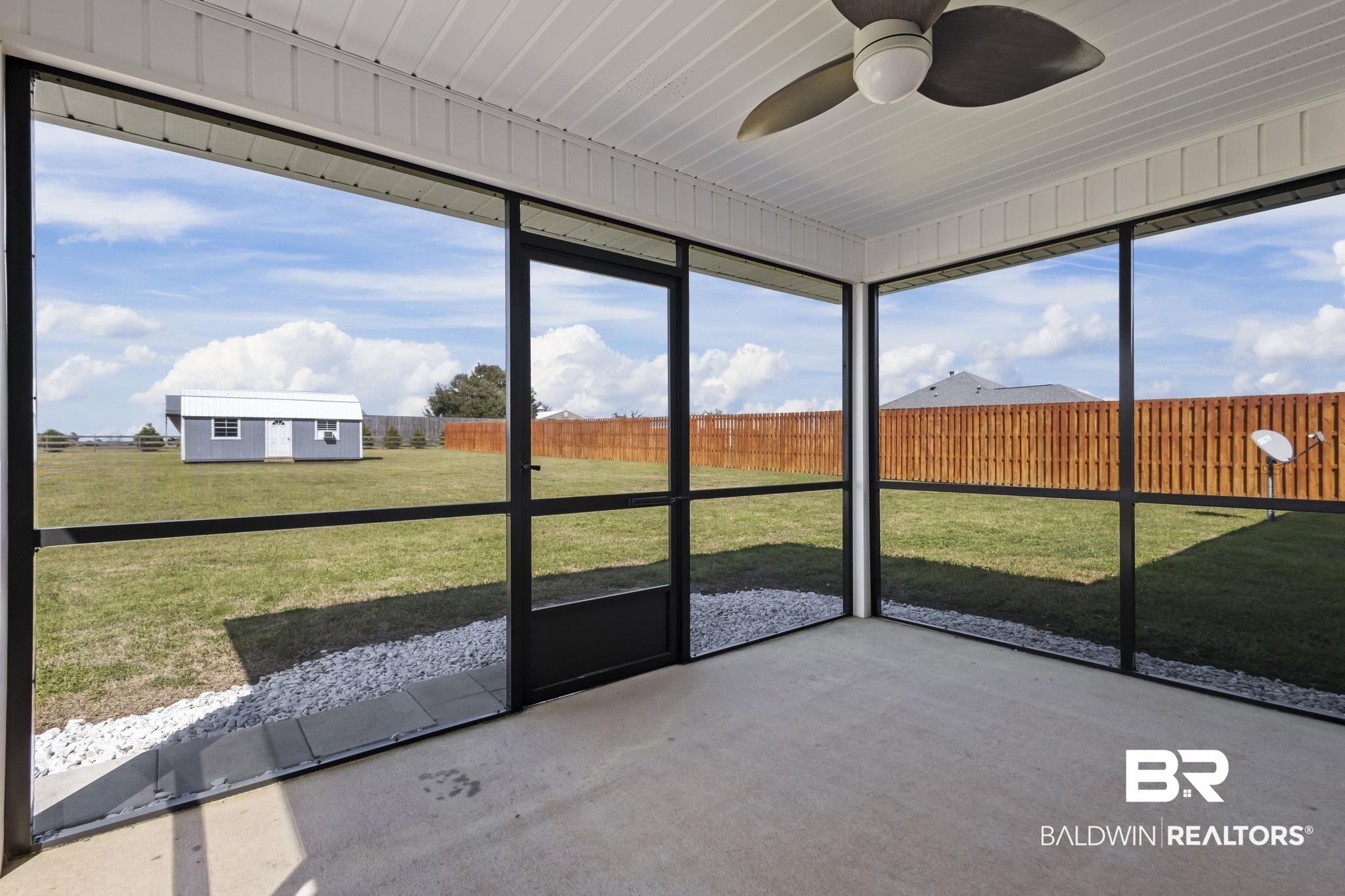8781 Baptist Camp Road Elberta, AL 36530 - Photo 25 of 44 Unfurnished sunroom featuring ceiling fan and a healthy amount of sunlight