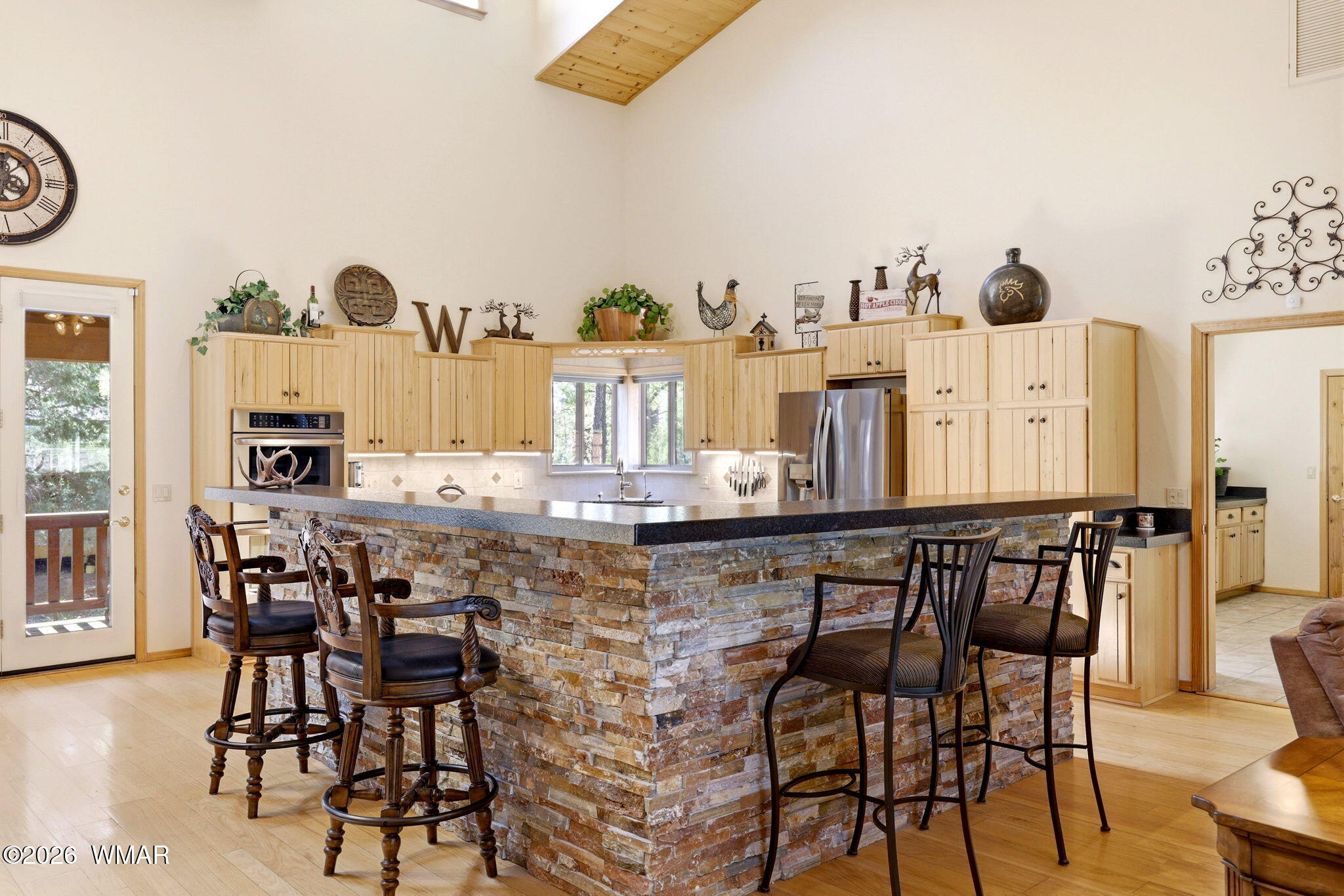 826 Pine Creek Circle Lakeside, AZ 85929 - Photo 5 of 65 a view of a dining room with furniture and wooden floor