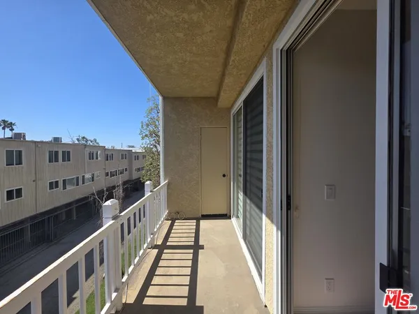 a view of room with a ceiling fan and window