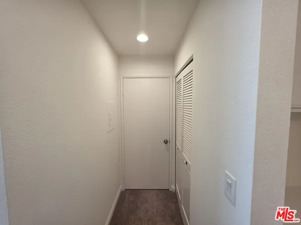 an empty room with a ceiling fan and a ceiling fan