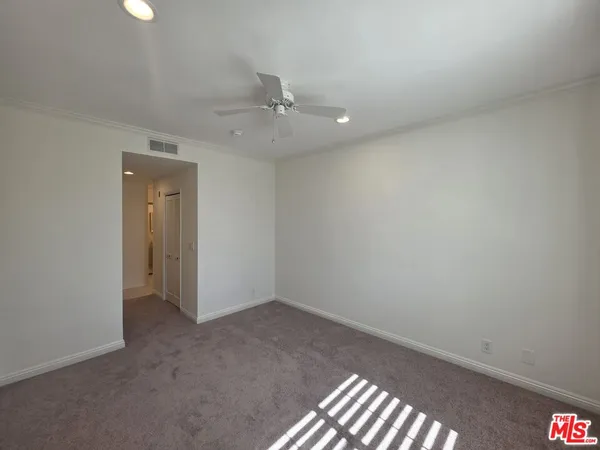 a view of a bathroom from the hallway