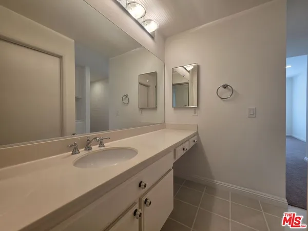 a view of a hallway with washer and dryer