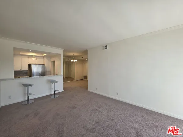a view of a chandelier fan and a chandelier fan in big room