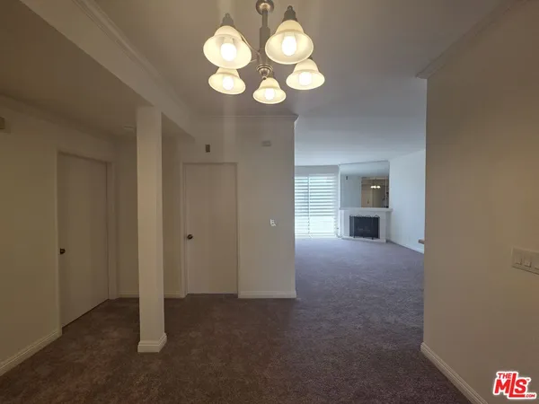 a view of a livingroom and a fireplace