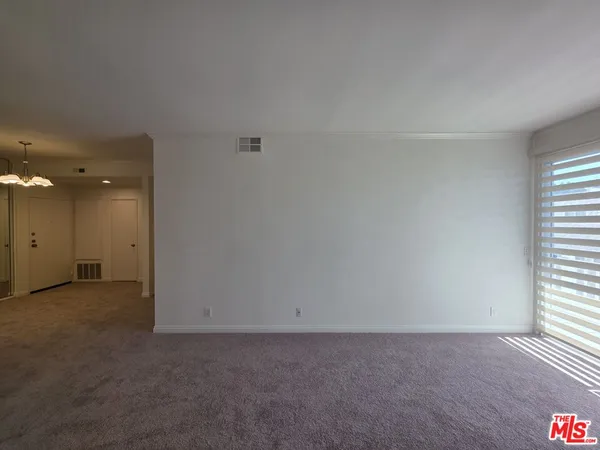 a kitchen with a refrigerator and a sink