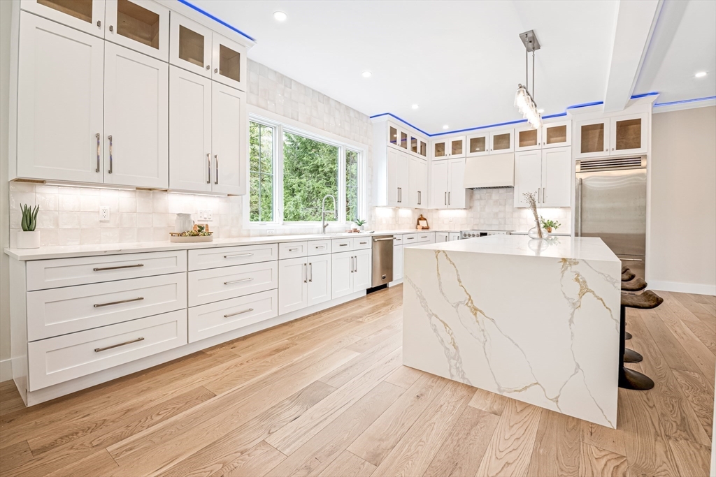 36 Oakmount Circle Lexington, MA 02420 - Photo 11 of 42 a kitchen with a sink window and cabinets
