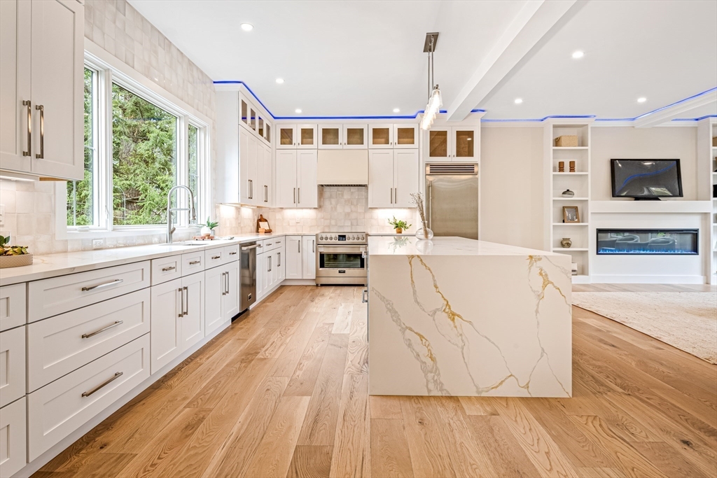 36 Oakmount Circle Lexington, MA 02420 - Photo 12 of 42 a large white kitchen with a large window a oven and stainless steel appliances