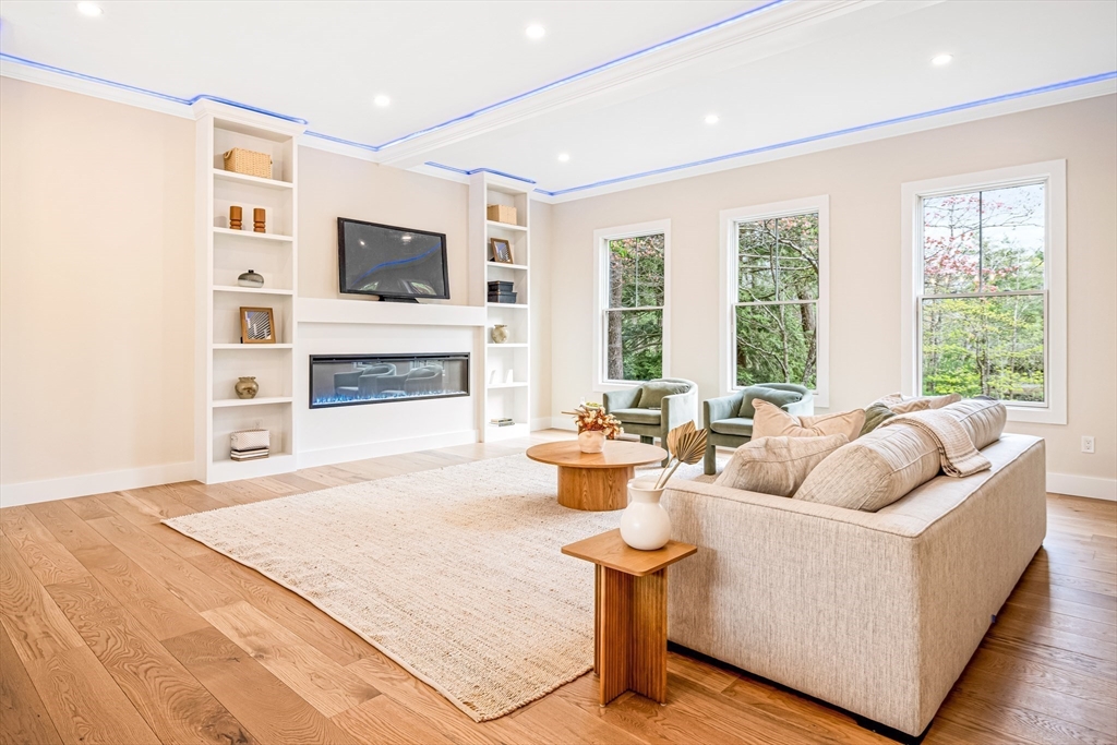 36 Oakmount Circle Lexington, MA 02420 - Photo 16 of 42 a living room with furniture fireplace and flat screen tv