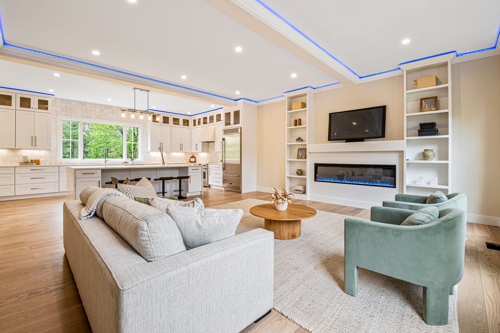 36 Oakmount Circle Lexington, MA 02420 - Photo 18 of 42 a living room with fireplace furniture and a flat screen tv
