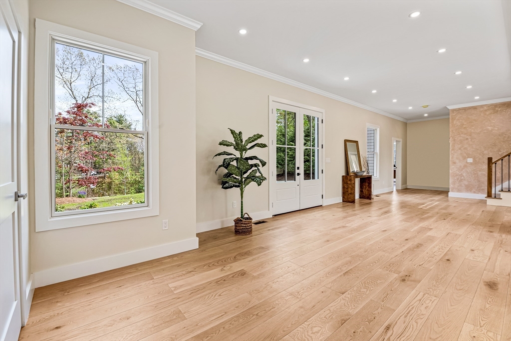 36 Oakmount Circle Lexington, MA 02420 - Photo 20 of 42 a view of an empty room with wooden floor and a window