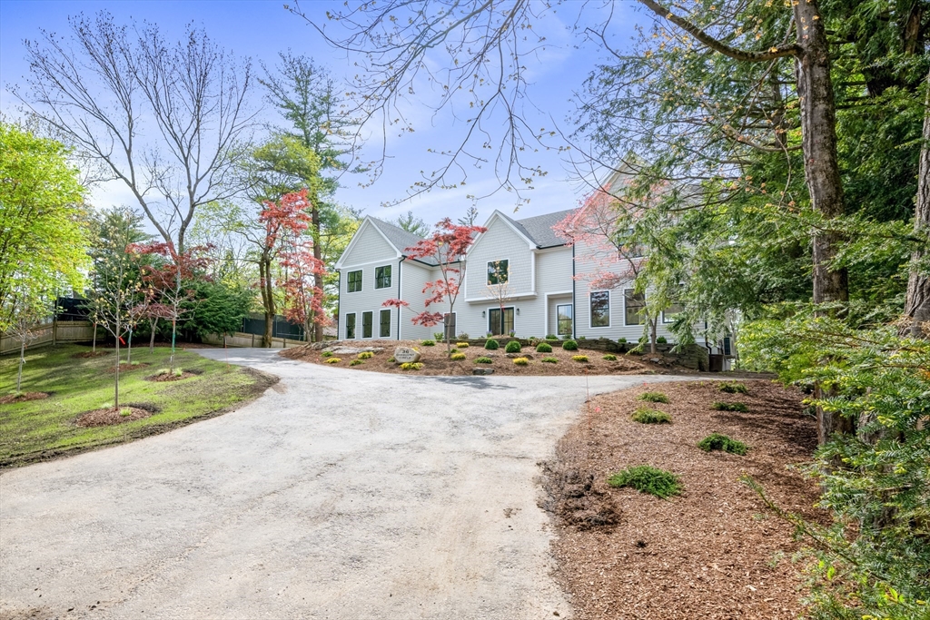 36 Oakmount Circle Lexington, MA 02420 - Photo 2 of 42 a building with trees in front of it