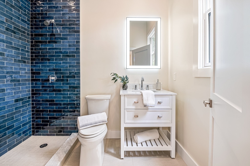 36 Oakmount Circle Lexington, MA 02420 - Photo 22 of 42 a bathroom with a sink a toilet and shower