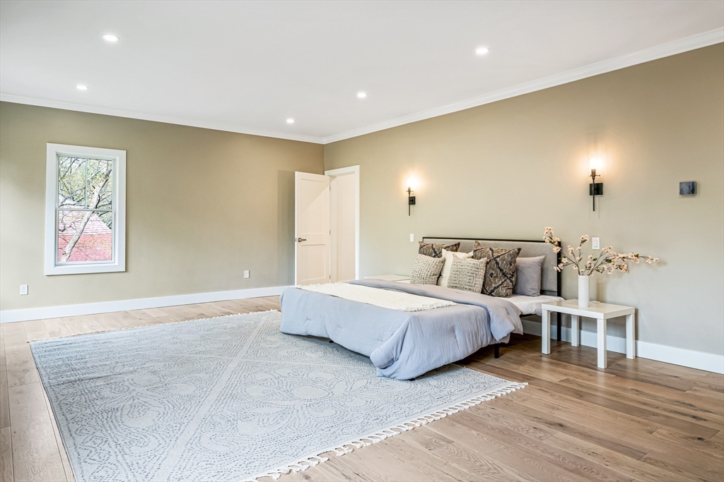 36 Oakmount Circle Lexington, MA 02420 - Photo 27 of 42 a spacious bedroom with a bed and wooden floor