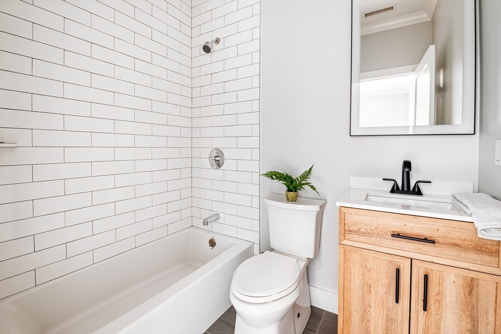 36 Oakmount Circle Lexington, MA 02420 - Photo 34 of 42 a bathroom with a sink a toilet and shower