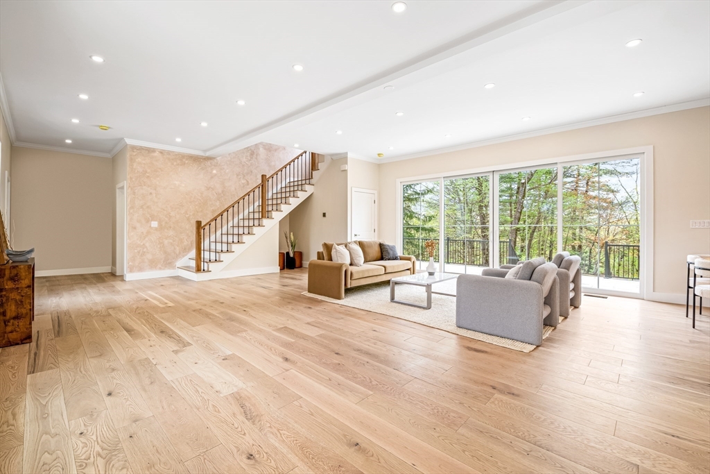 36 Oakmount Circle Lexington, MA 02420 - Photo 4 of 42 a spacious bedroom with a large bed and large windows