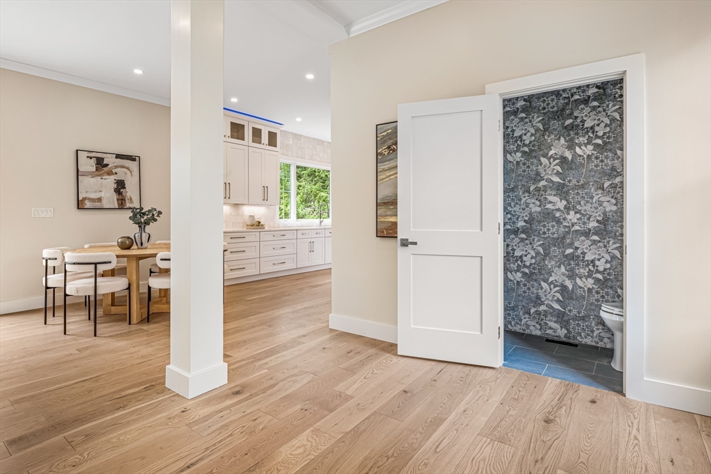 36 Oakmount Circle Lexington, MA 02420 - Photo 9 of 42 a view of a hallway with wooden floor and a living room