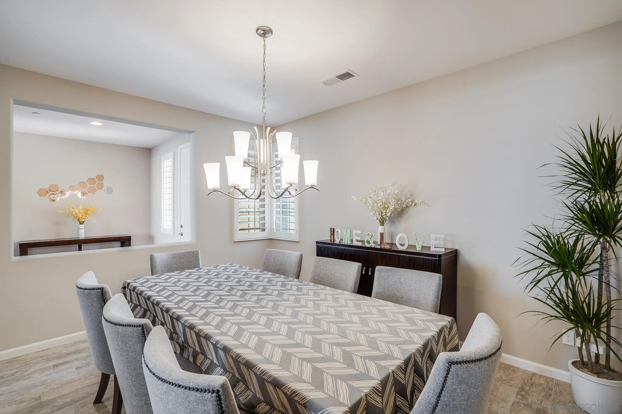 5662 Rancho Del Caballo Bonsall, CA 92003 - Photo 20 of 60 a view of a dining room with furniture and chandelier