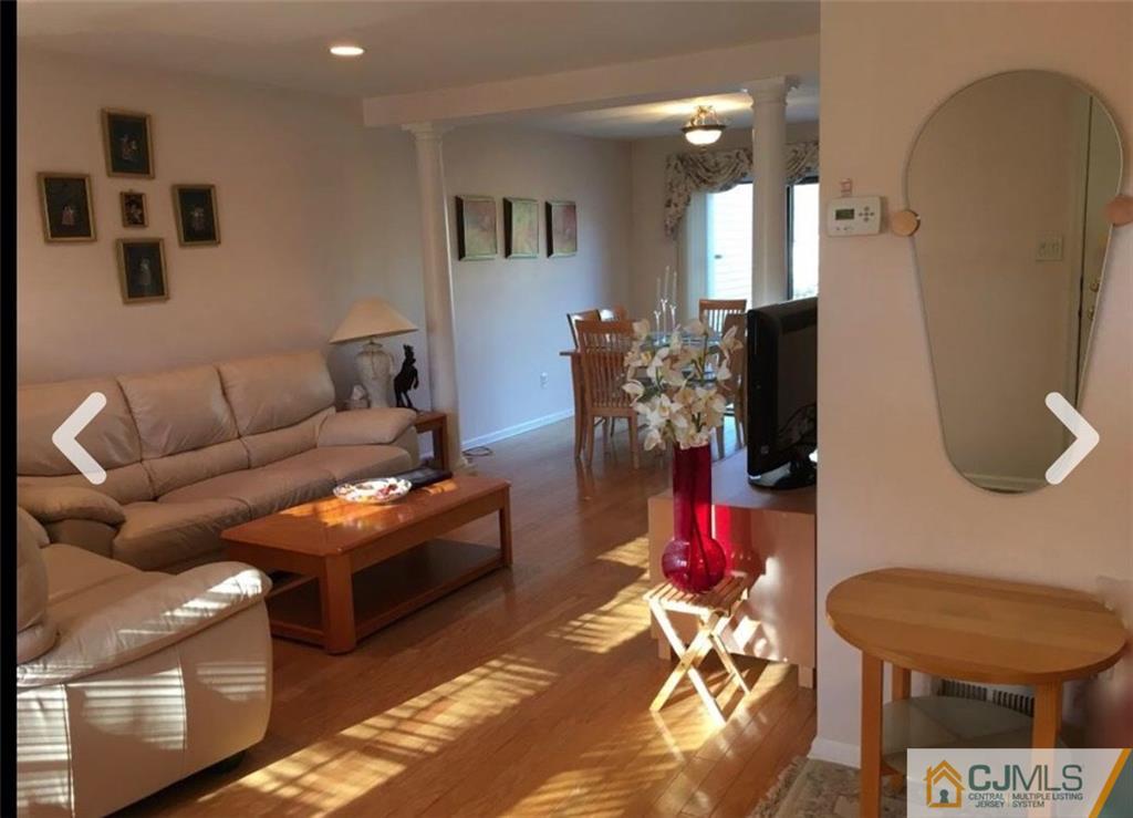 1504 Maplecrest Road Edison, NJ 08820 - Photo 2 of 15 a living room with furniture and wooden floor