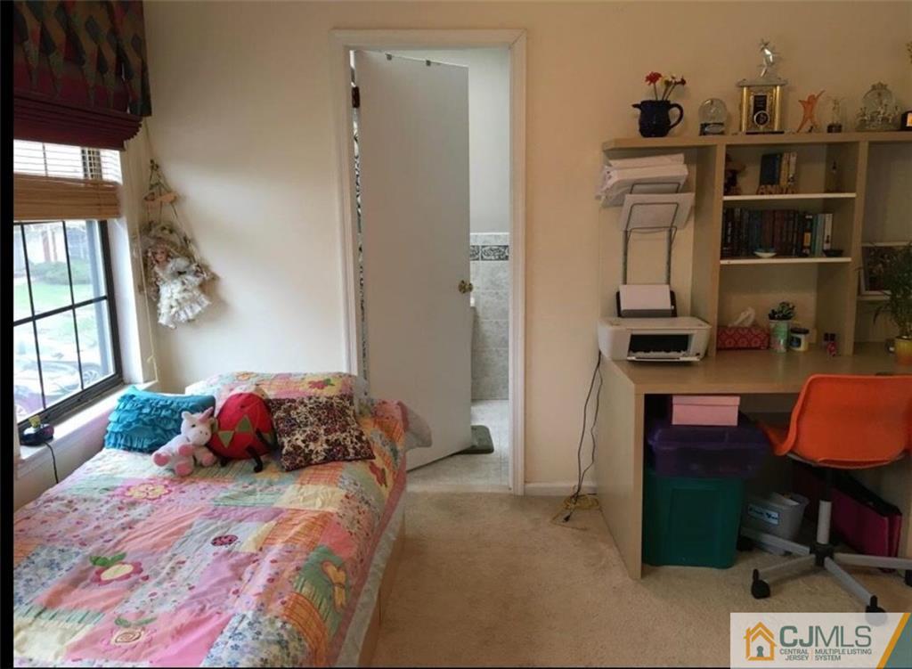 1504 Maplecrest Road Edison, NJ 08820 - Photo 11 of 15 a bedroom with a bed and a window