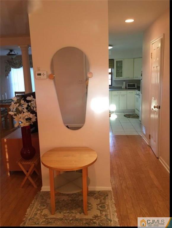 1504 Maplecrest Road Edison, NJ 08820 - Photo 6 of 15 a bathroom with a sink and a mirror