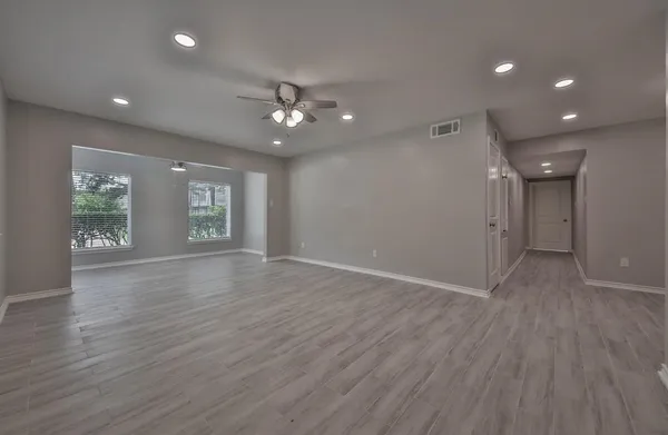a view of livingroom with hardwood floor and ceiling fan