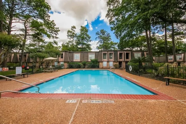 a view of swimming pool with chairs