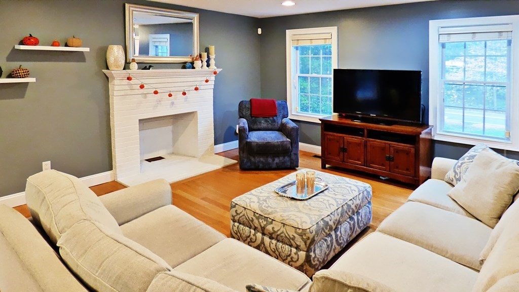 255 Holmes Street Hanson, MA 02341 - Photo 12 of 34 a living room with furniture and a flat screen tv