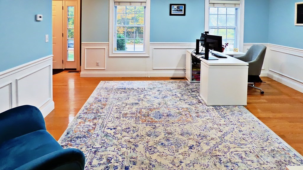 255 Holmes Street Hanson, MA 02341 - Photo 15 of 34 a living room with a couch and a table