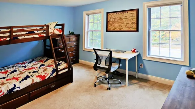 a bed room with furniture and a window