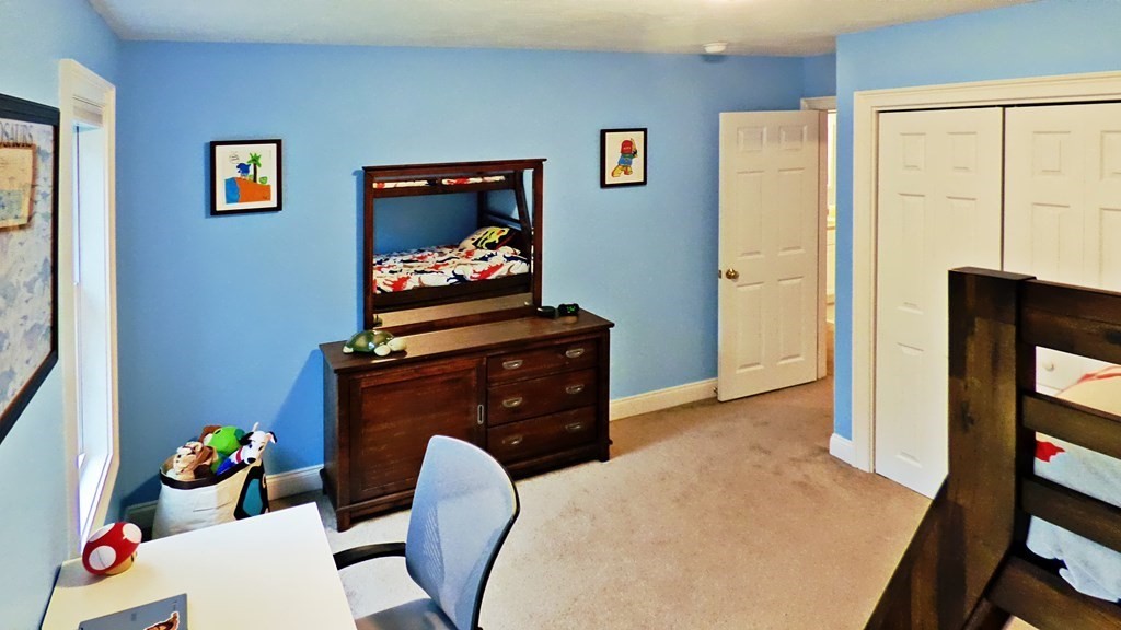 255 Holmes Street Hanson, MA 02341 - Photo 25 of 34 a living room with furniture and flat screen tv