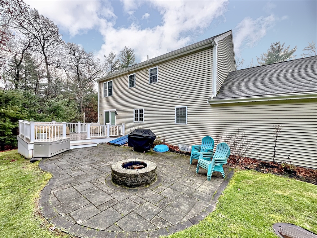 255 Holmes Street Hanson, MA 02341 - Photo 28 of 34 a view of a house with backyard and furniture