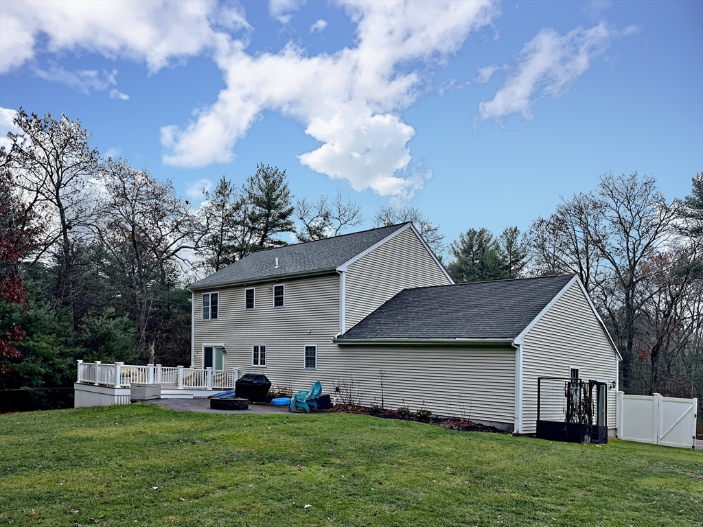 255 Holmes Street Hanson, MA 02341 - Photo 32 of 34 a front view of house with yard and green space