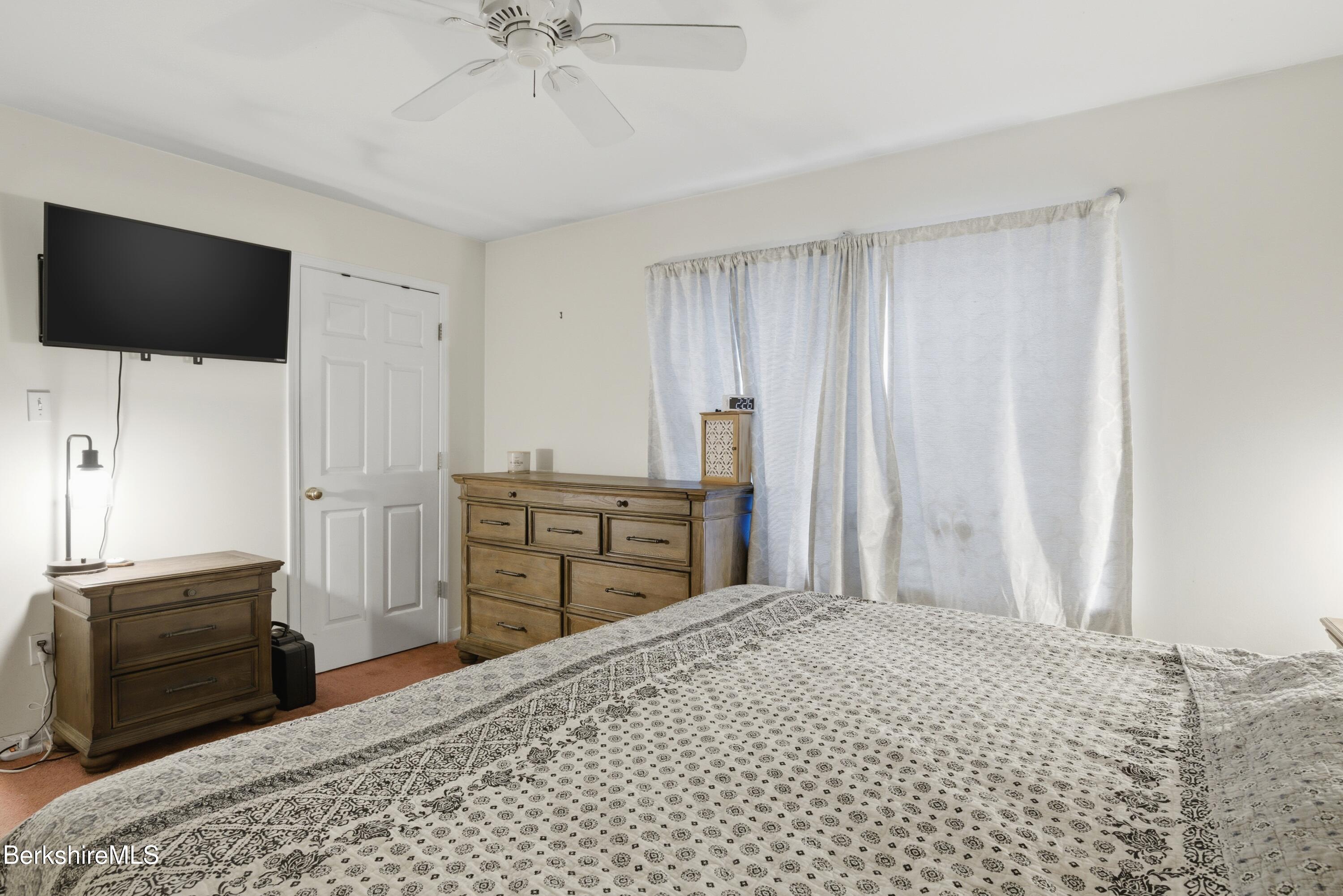 51 Notch Road North Adams, MA 01247 - Photo 16 of 21 a bedroom with a bed and a flat screen tv