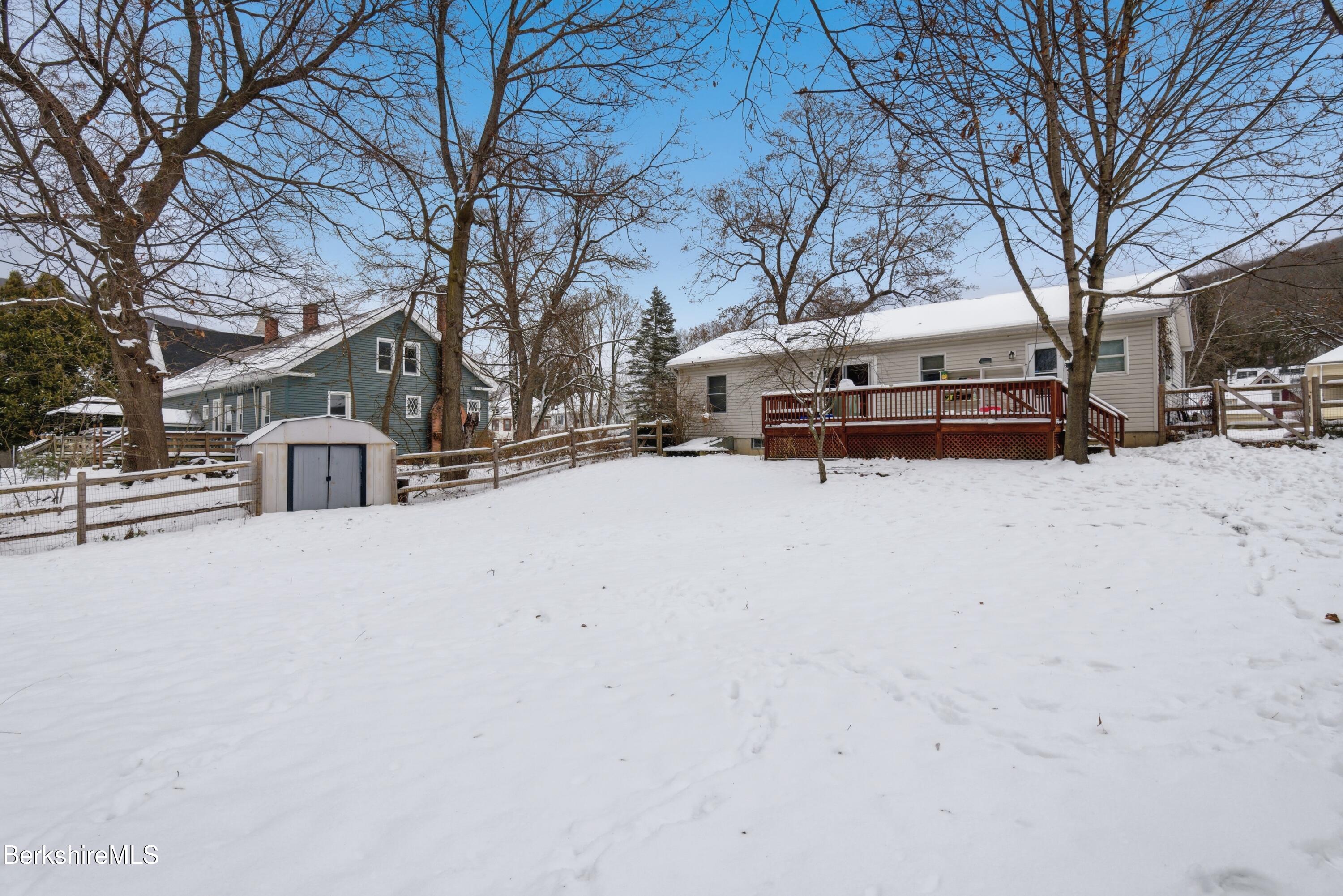 51 Notch Road North Adams, MA 01247 - Photo 4 of 21 a wooden bench sitting in middle of a snow
