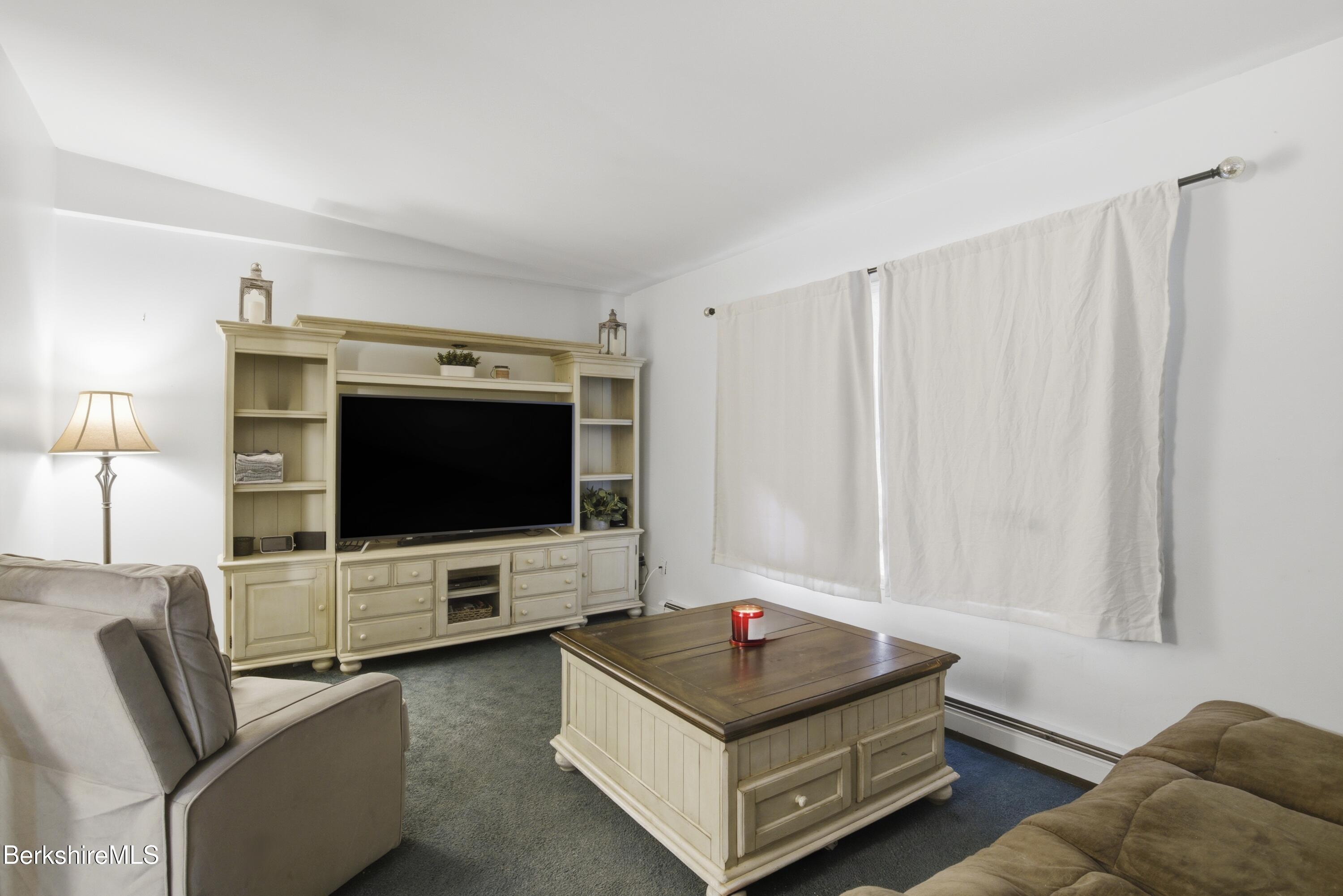 51 Notch Road North Adams, MA 01247 - Photo 8 of 21 a living room with furniture and a flat screen tv