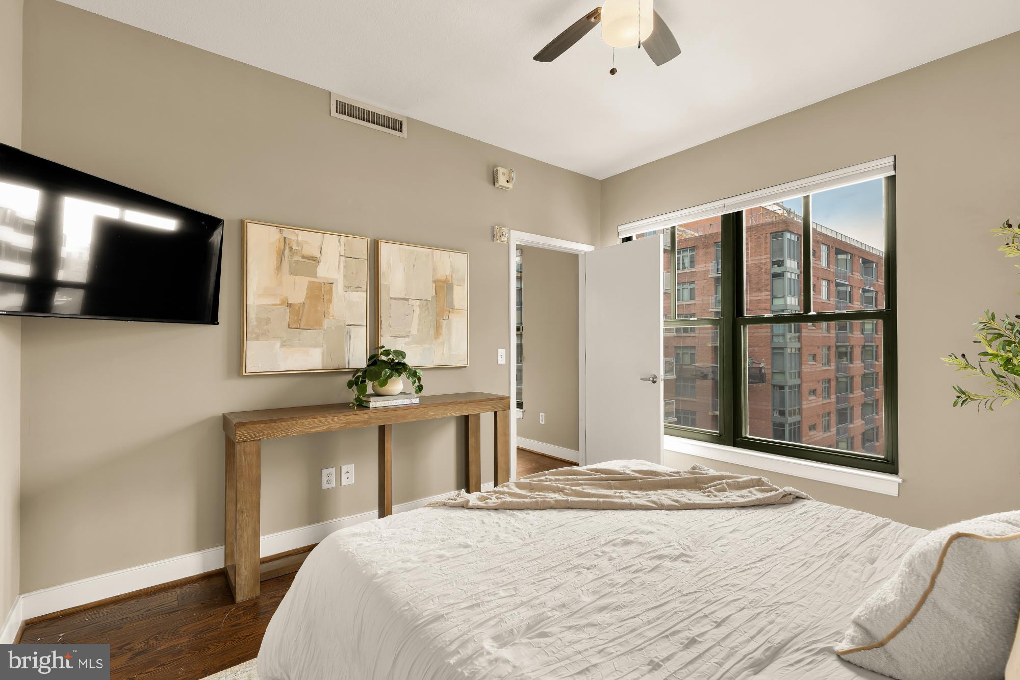 910 M Street Northwest, Unit 804 Washington, DC 20001 - Photo 20 of 32 Modern bedroom with urban views.