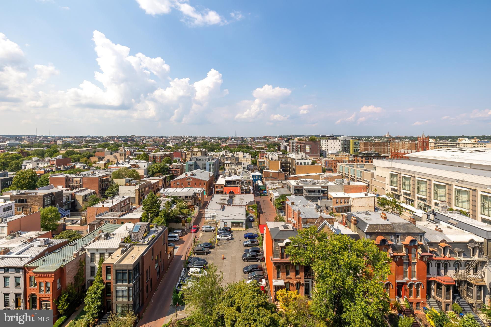 910 M Street Northwest, Unit 804 Washington, DC 20001 - Photo 31 of 32 Vibrant cityscape under a bright sky.