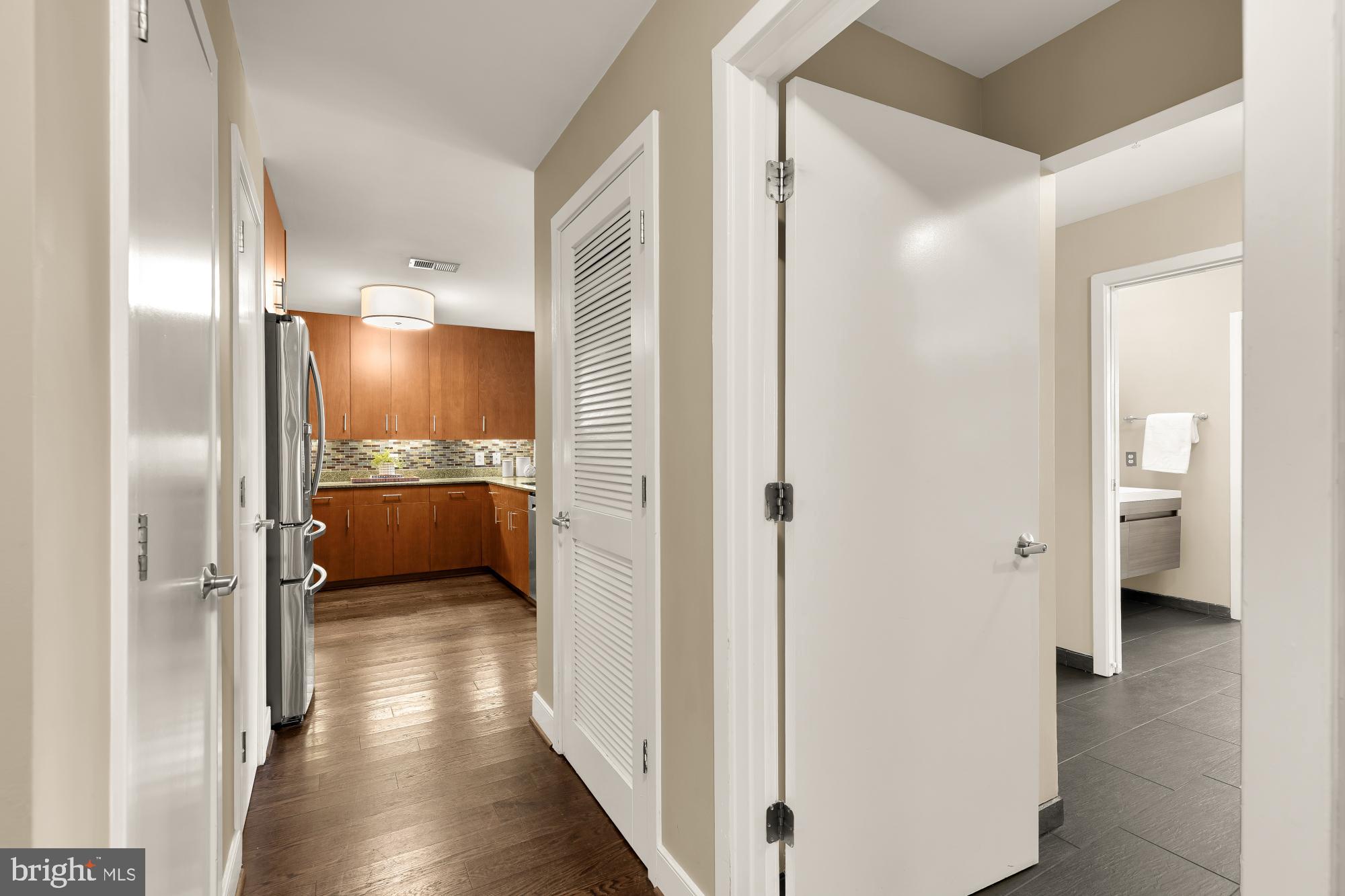 910 M Street Northwest, Unit 804 Washington, DC 20001 - Photo 6 of 32 Modern hallway leading to stylish kitchen.