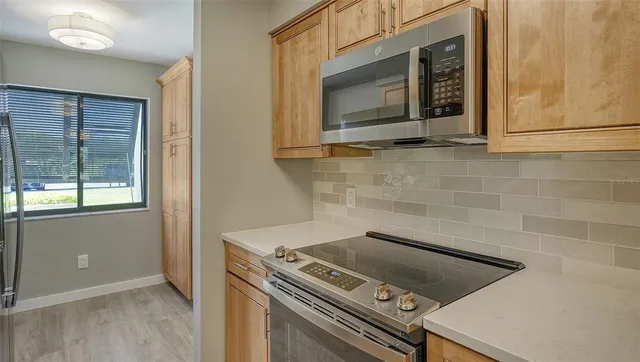a kitchen with a stove and a microwave