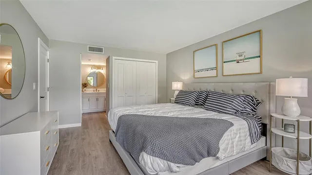 a bedroom with a bed and a mirror