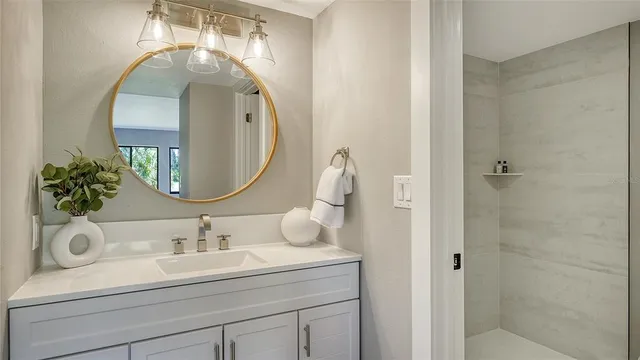 a bathroom with a sink and a mirror