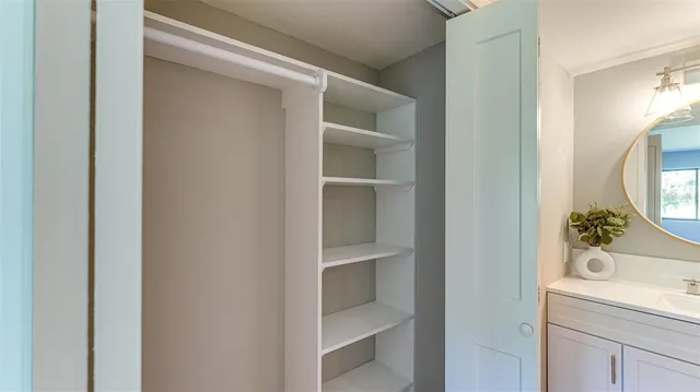 a bathroom with a toilet and a mirror