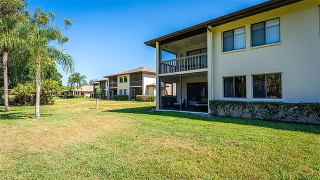 a view of an house with swimming pool and porch