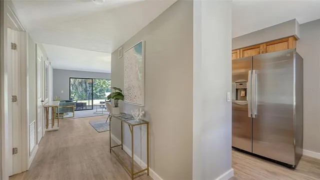 a view of a kitchen from the hallway