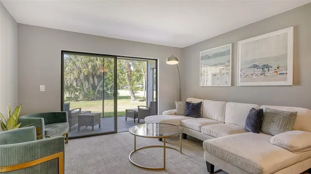 a living room with furniture and a large window